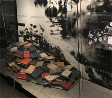 Museum display of pile of books