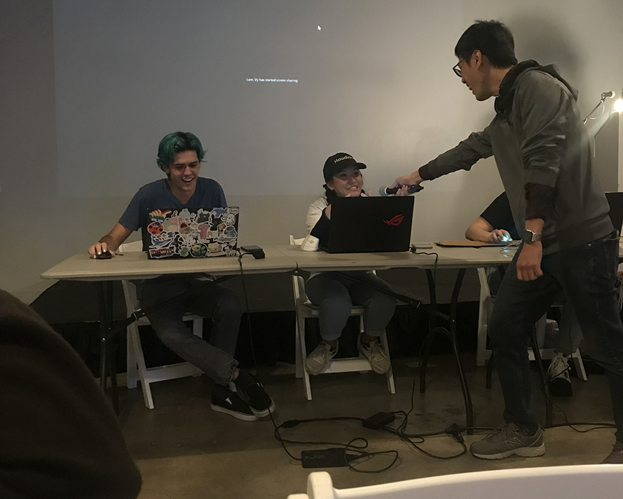 A student is declared the winner of an art battle.