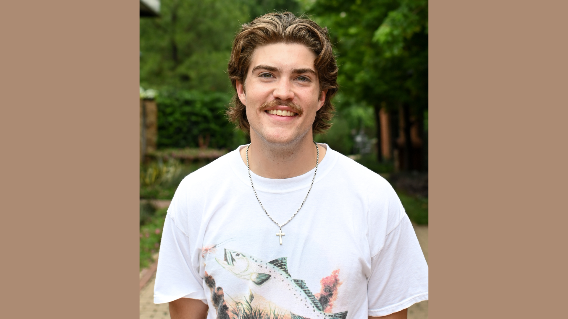 A college student smiles for a portrait.