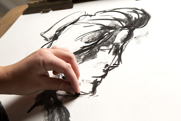 A close-up view of a sketch being worked on by a college student.