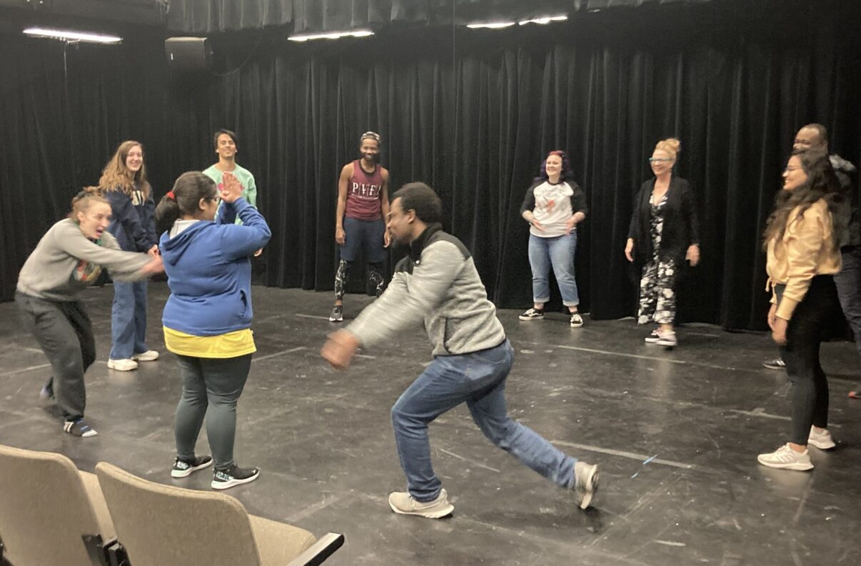 Students participate in an acting improv session.