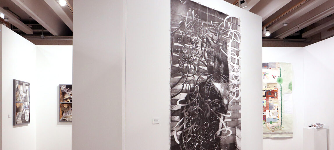Several paintings hang in a gallery. The focus of the gallery images is the center with a black cat surrounded by swirls.