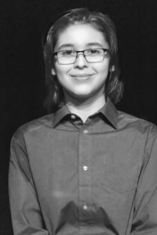 A black-and-white portrait of a college student