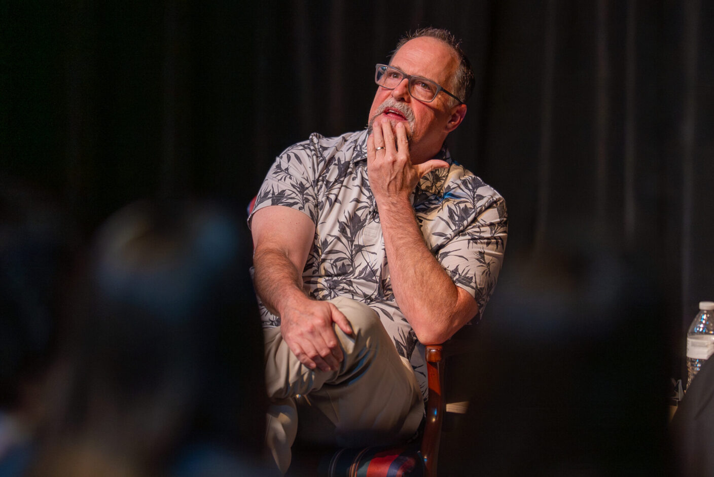 Dave Maldonado sits in a chair. 