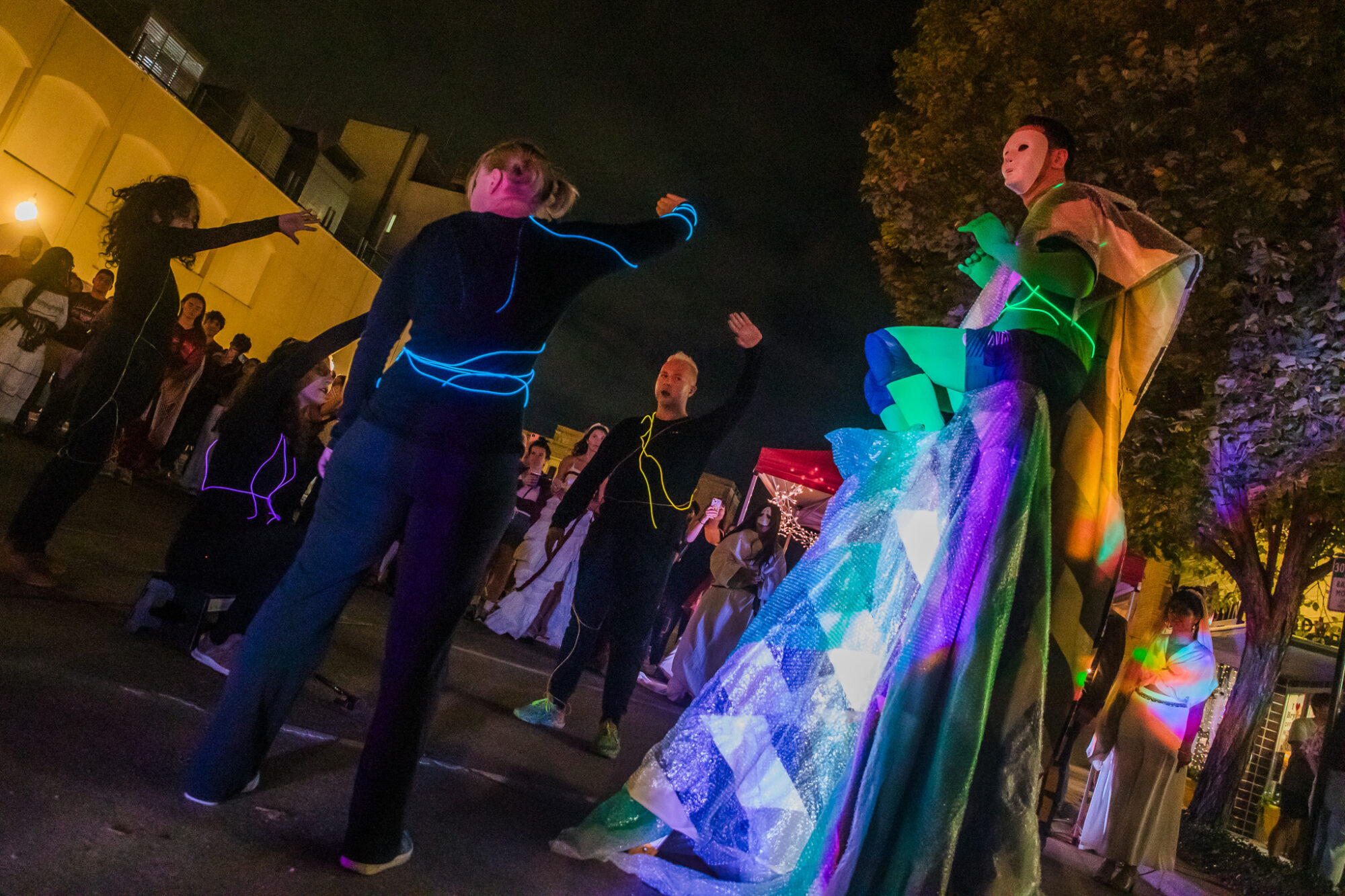 A crowd of people are dressed for a Halloween event in Downtown Bryan.
